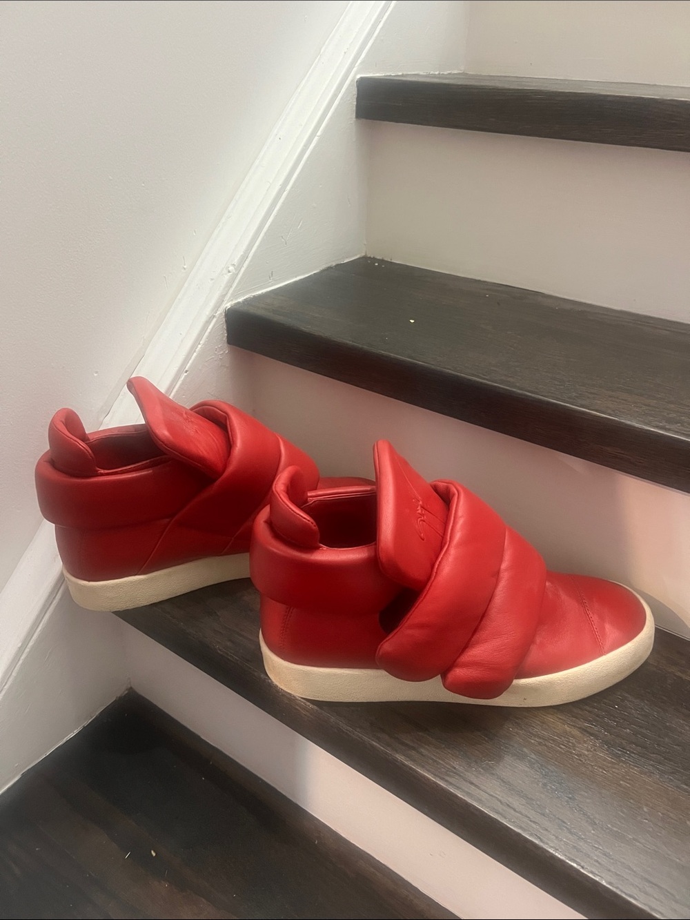 Giuseppe Zanotti/ Kid Cudi puffy strap red leather sneakers.
